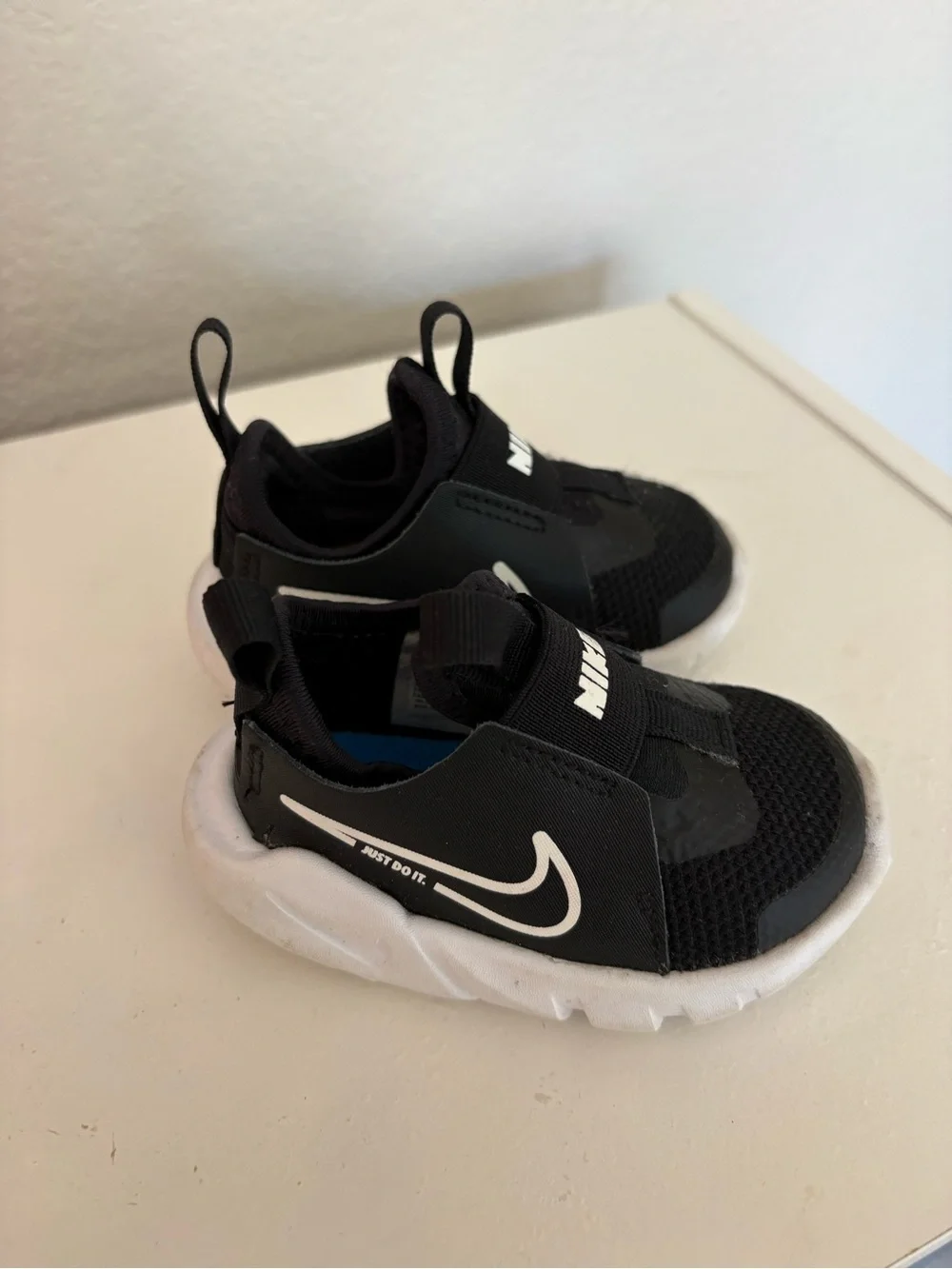Nike Kids Black and White Swoosh Slip-On Sneakers